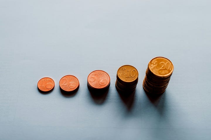 Relaxing hammock. Coins stacking like compound interest. Photos by Austin Schmid and Marcus Strauss via Unsplash.