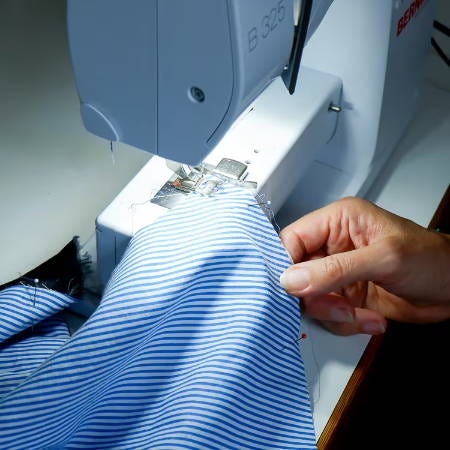 sewing two fabric pieces together using a magnetic seam guide sewing two fabric pieces together using a magnetic seam guide