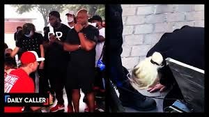 This video emerged of a white woman kissing the boots of black men. Has this gone too far? | The Daily Caller | Facebook This video emerged of a white woman kissing the boots of black men. Has this gone too far? | The Daily Caller | Facebook