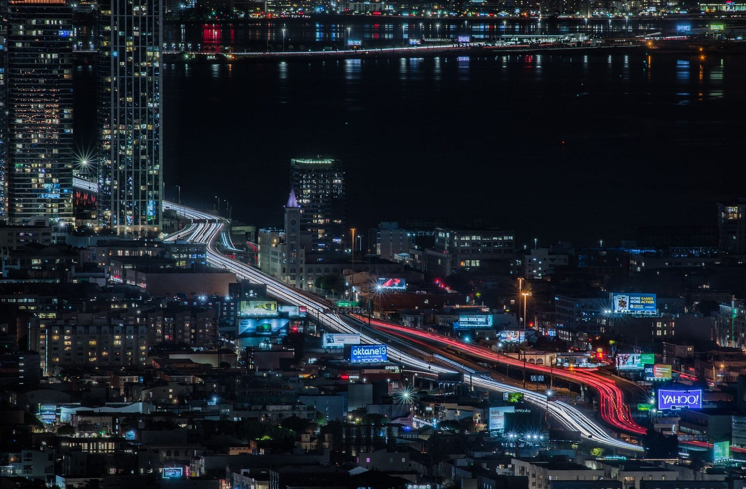 Billboards at night. The billboards shown here are mostly the non-digital kind that are lit by spotlights. San Francisco, California, February 25, 2019. (Image source: Patrick Boury / Creative Commons)