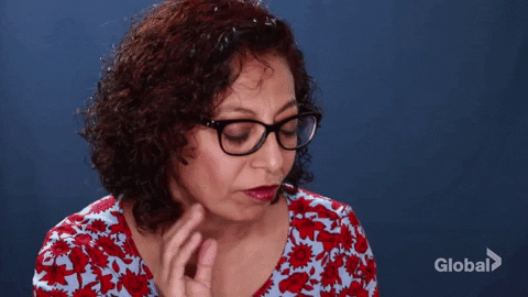 A woman cups her hear and leans forward A woman cups her hear and leans forward