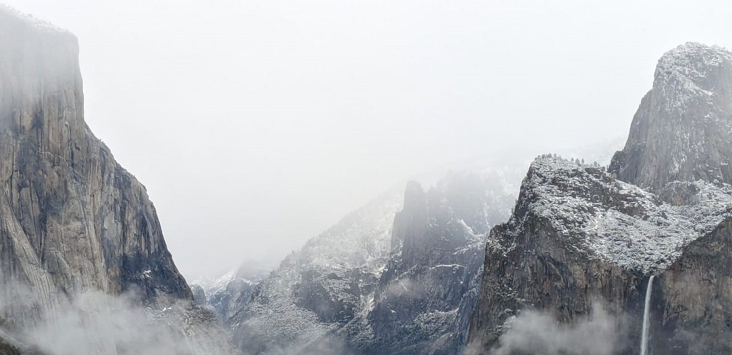 Foggy landscape of tunnel view at Yosemite, large rocky hills