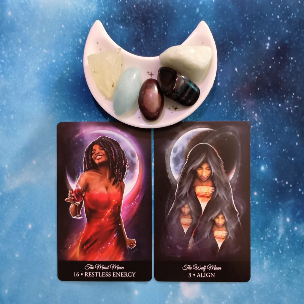 Don't Chase, Align! A Message From the Universe, 2 Witching Hour Oracle cards and crystals on a starry blue background