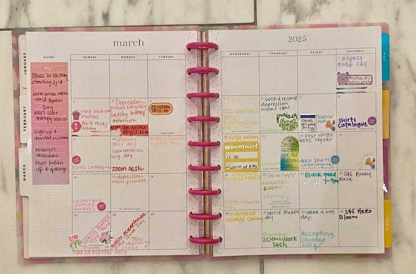 My Happy Planner opened to the month of March. My planner is rainbow coordinated