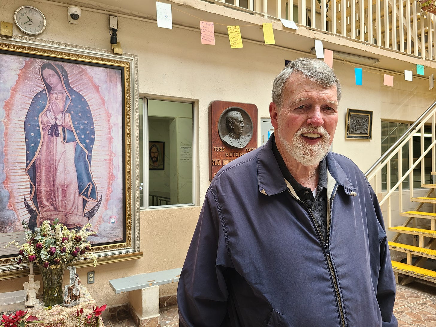 Father Patrick Murphy stands in front of an image of the Virgin of Guadalupe in the courtyard of the shelter Father Patrick Murphy stands in front of an image of the Virgin of Guadalupe in the courtyard of the shelter