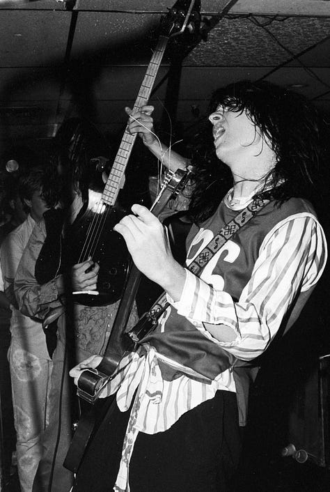 Gallery of 9 images of band Redd Kross, a rockband playing live in a small club called Cathay de Grande in Los Angeles.