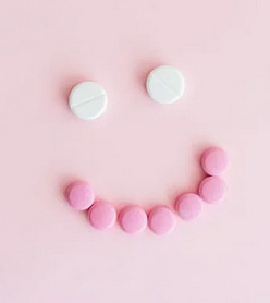 Smiley face made with pills