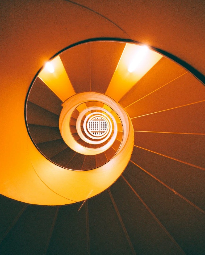 orange and brown spiral staircase