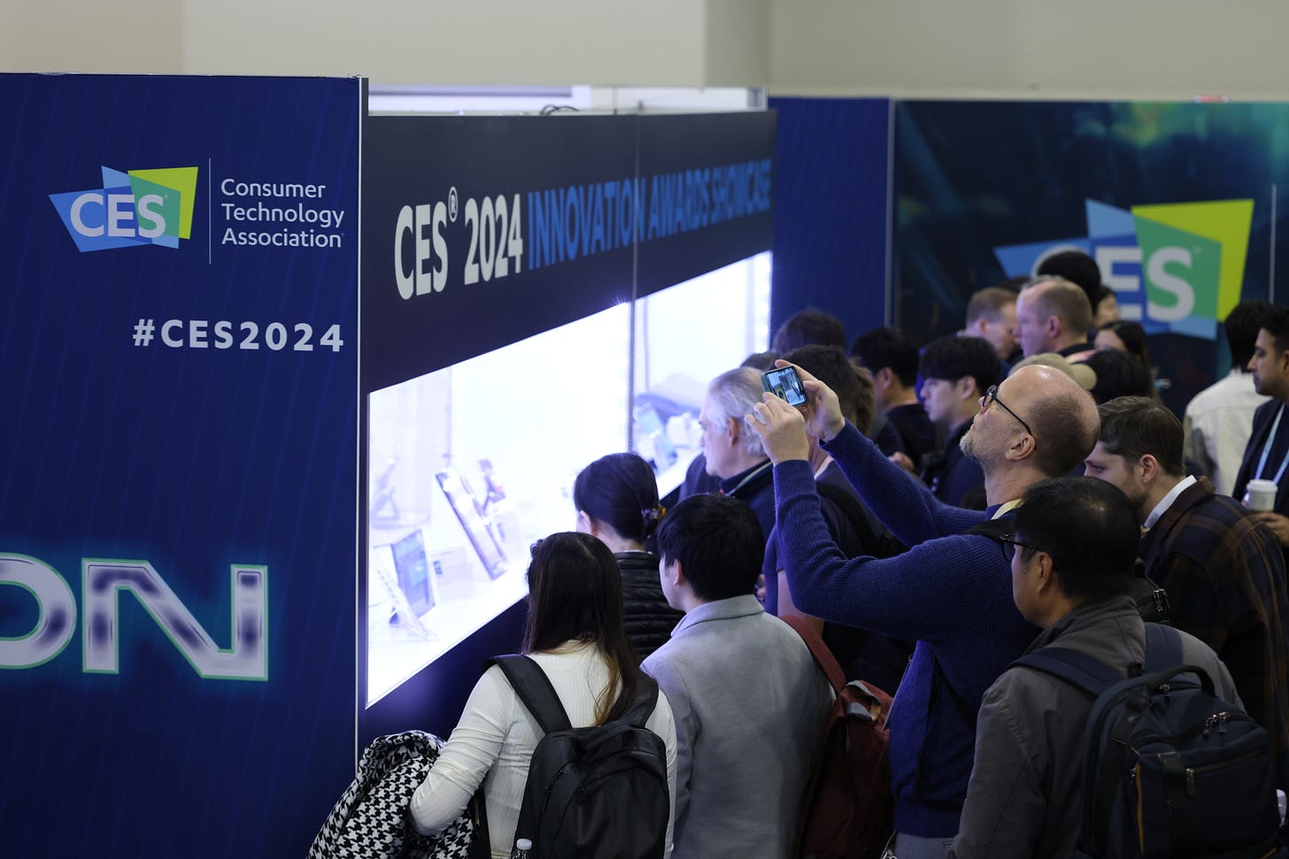 A photo of people looking at new products at CES 2024
