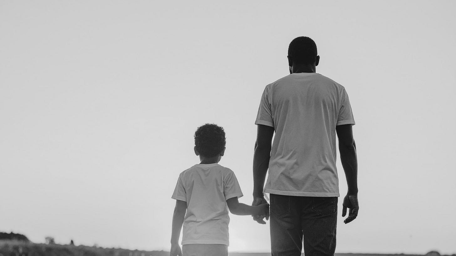 Black father and child holding hands. Black father and son. Black Fatherhood Black father and child holding hands. Black father and son. Black Fatherhood