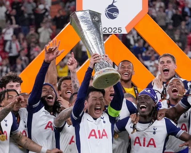 Son Heung-min holds up the trophy after Tottenham beat Manchester United in the Europa League final. Photograph: Bernat Armangué/AP