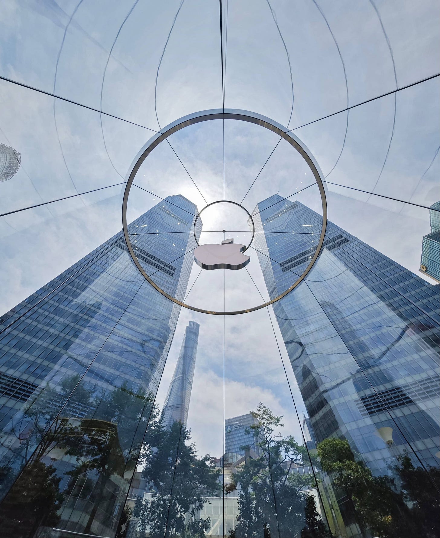The interior of the glass drum entrance to Apple Pudong, photographed during the day from the store floor. The interior of the glass drum entrance to Apple Pudong, photographed during the day from the store floor.