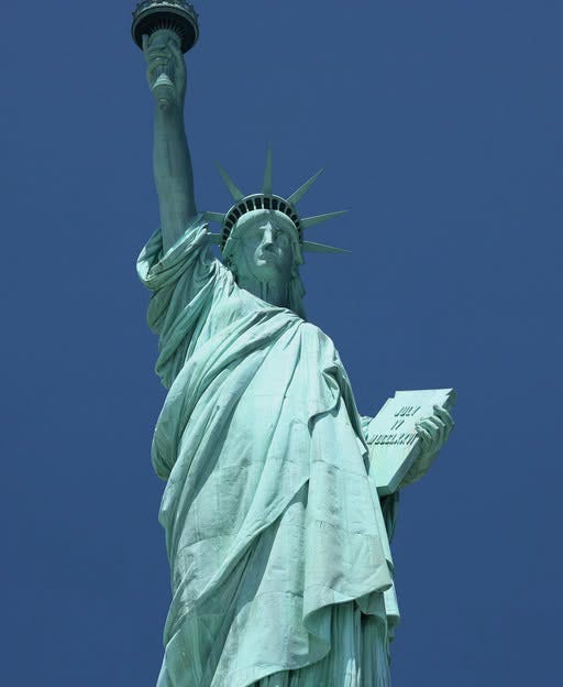 May be an image of the Statue of Liberty