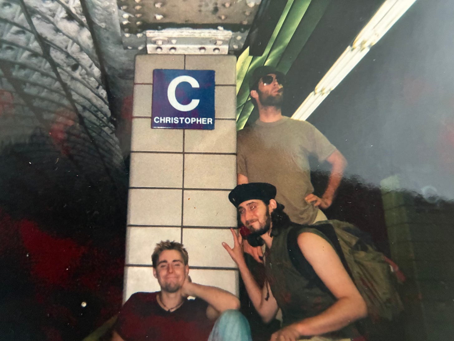 Dominic and two friends pose in a West Village NYC train station, near a column that reads "Christopher." Dominic and two friends pose in a West Village NYC train station, near a column that reads "Christopher."
