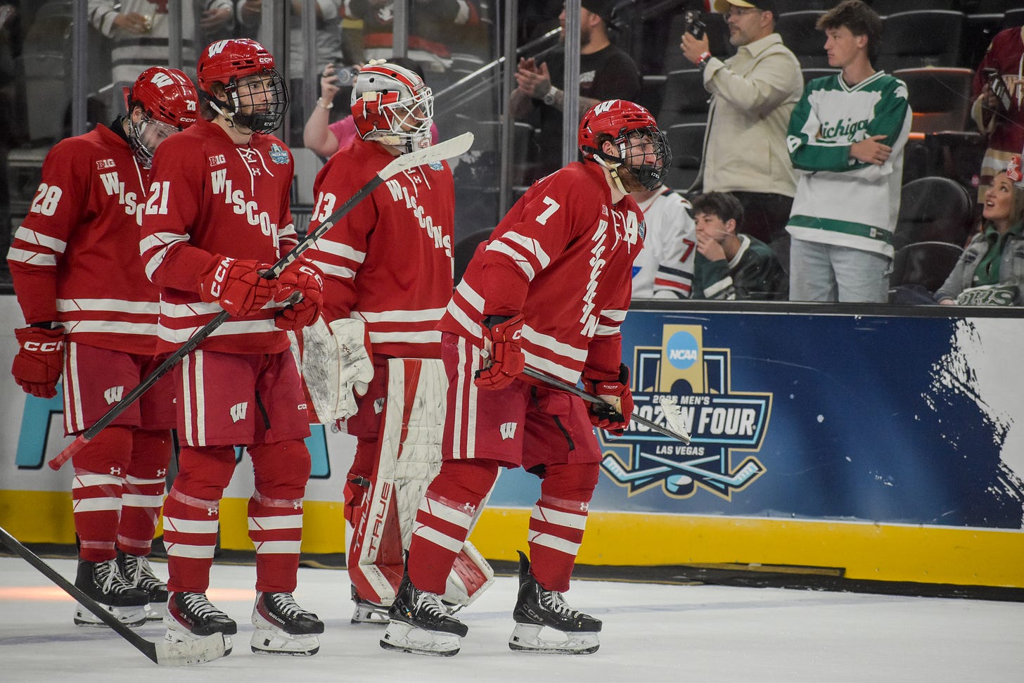 Wisconsin badgers players skate off ice. Gavin Morrissey, Aiden Dubinsky, Ryan Botterill, Anton Castro. Wisconsin badgers players skate off ice. Gavin Morrissey, Aiden Dubinsky, Ryan Botterill, Anton Castro.