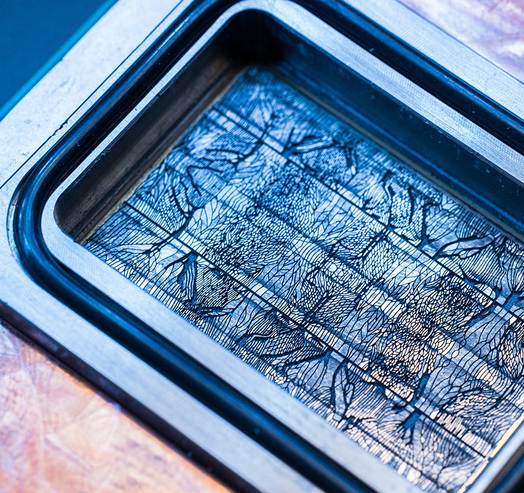 A microfluidics computer chip showing microchannel grooves A microfluidics computer chip showing microchannel grooves