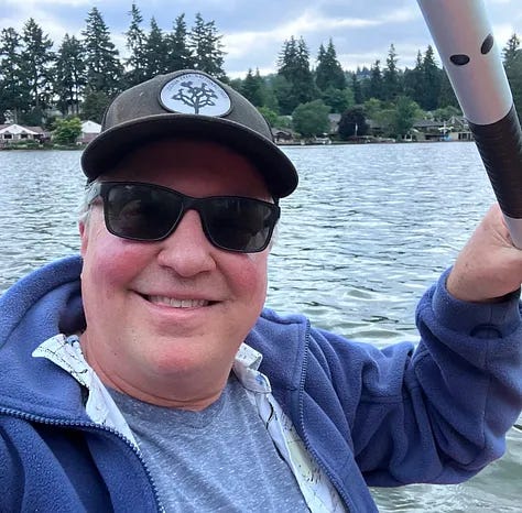 Ducks in Willamette river, Kacey in lake holding a paddle, river view