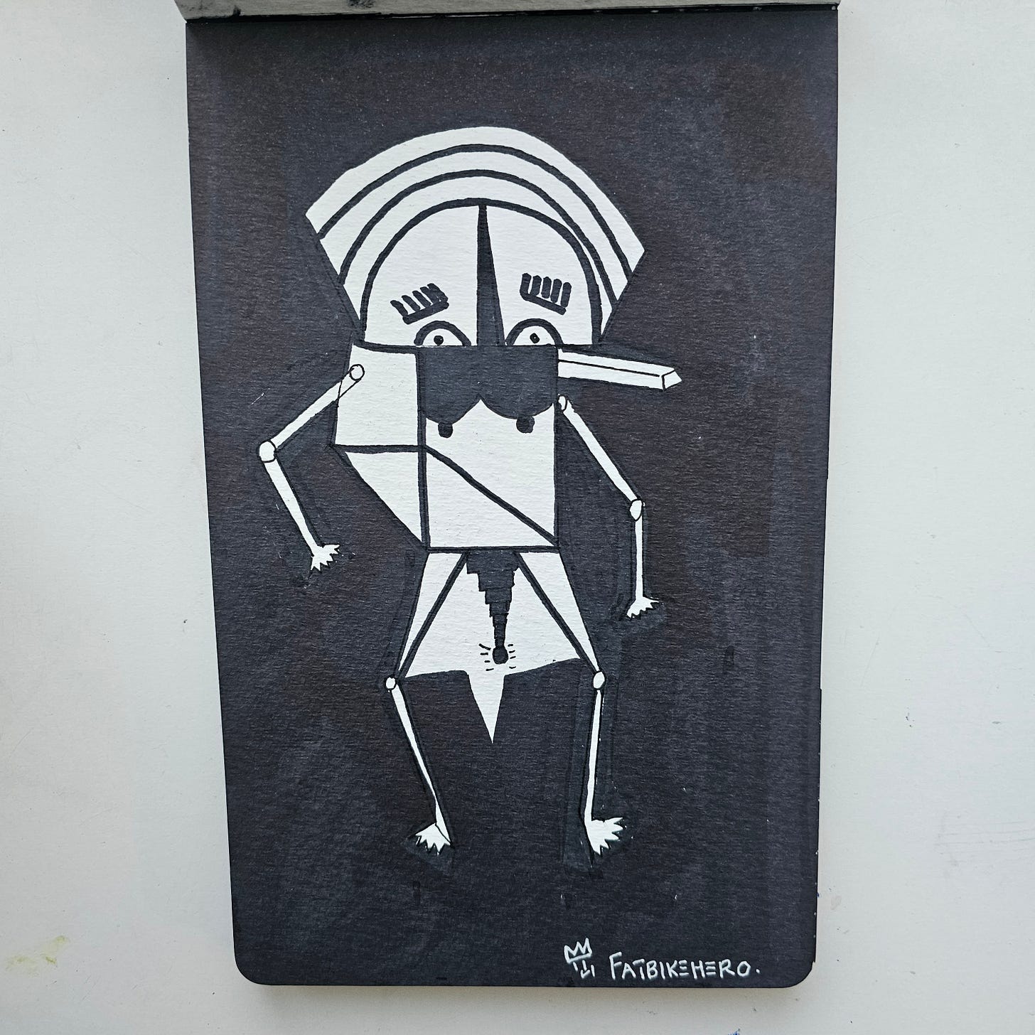 ​FatbikeHero (b. 1983) presents Happy New Year Shine Eye A.I. (2025), a stark and arresting monochromatic work on paper. Executed on New Year’s Eve 2025 in Vorre-Skodstrup, this piece introduces a seminal character in the artist’s 2026 oeuvre. Blending the rawness of street art with the structural precision of geometric abstraction, the work explores themes of artificial sentience (”Shine Eye A.I.”) and creative genesis.