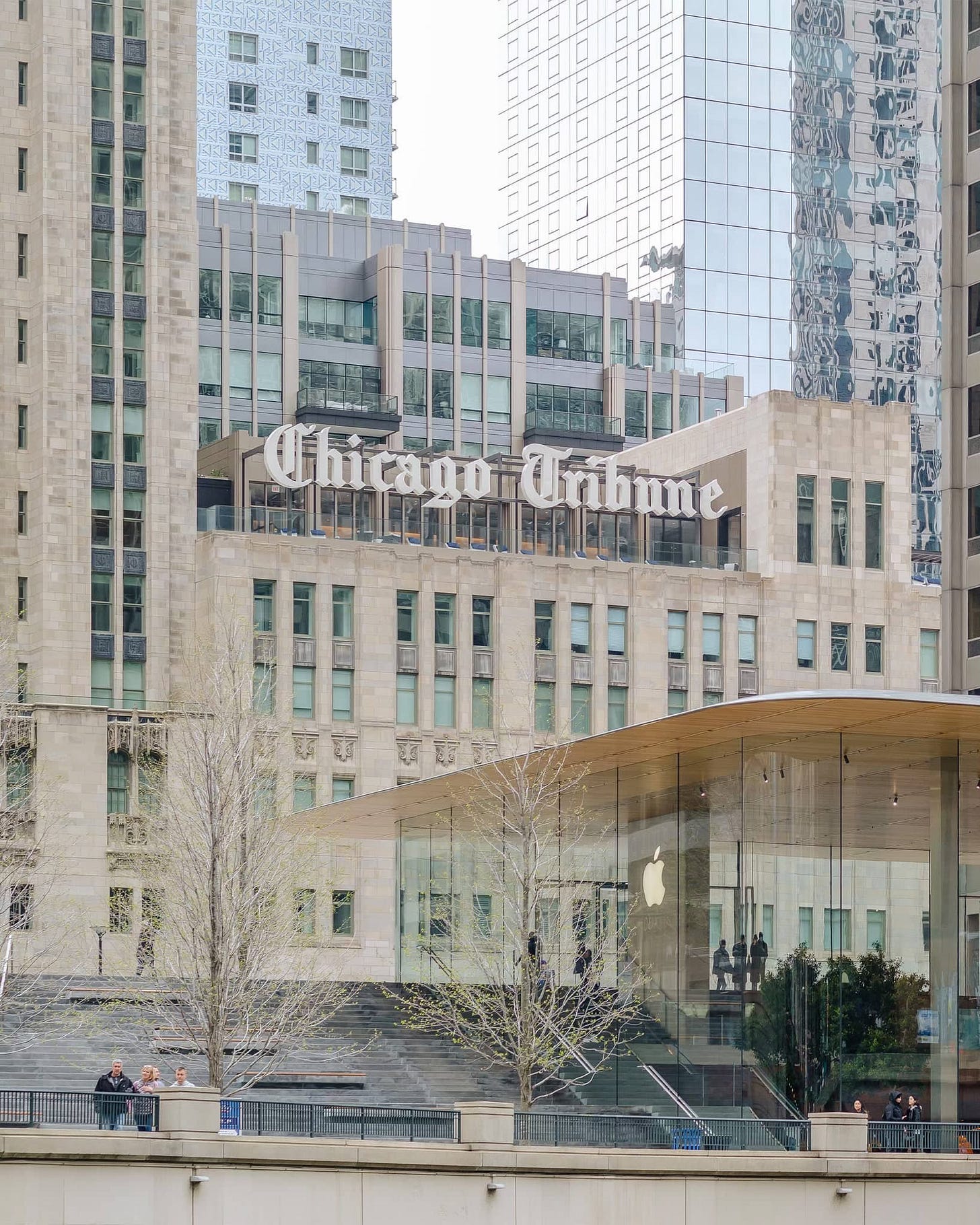 The exterior of Apple Michigan Avenue pictured from the Chicago River.
