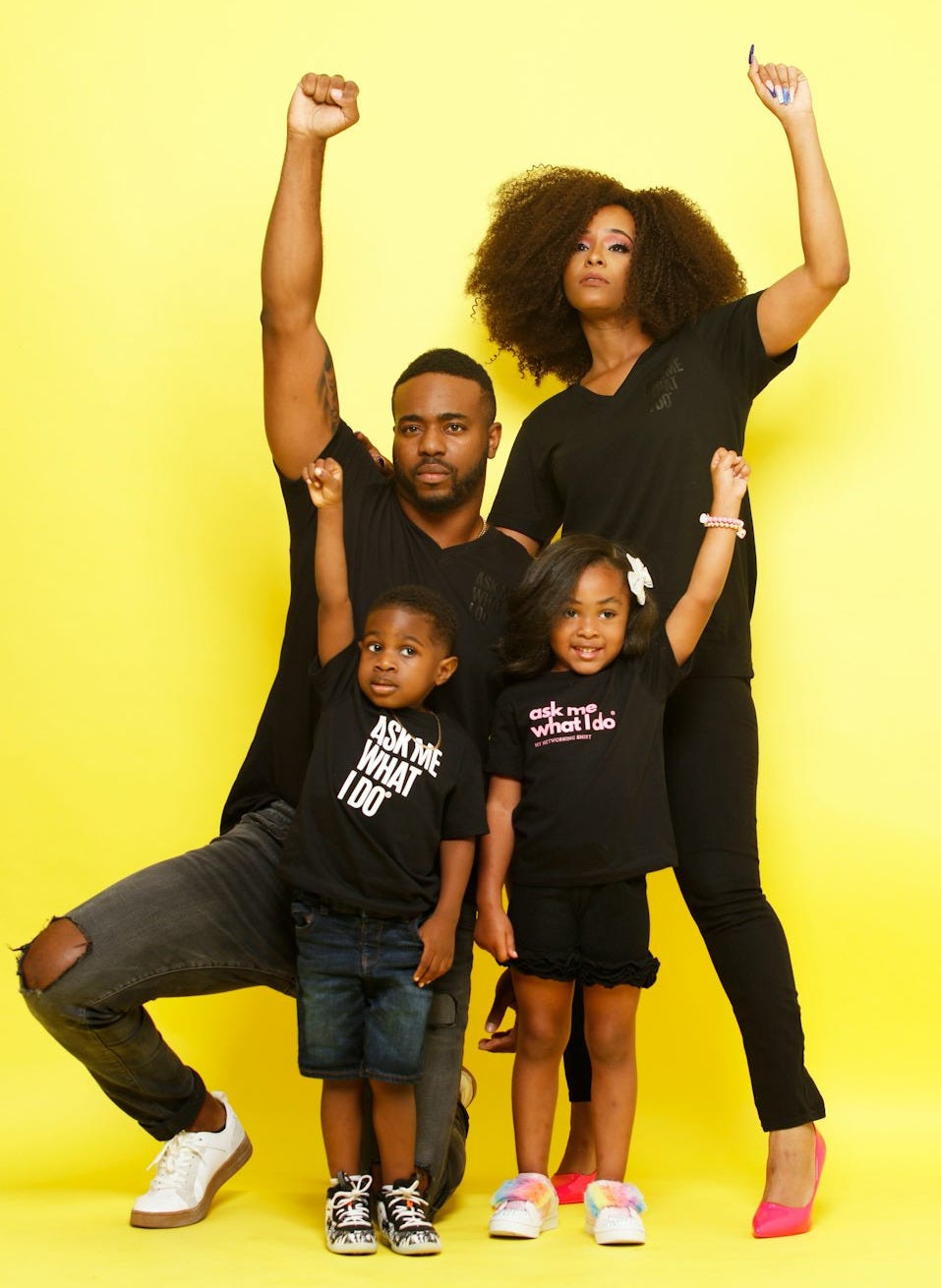 3 women in black t-shirt and blue denim jeans