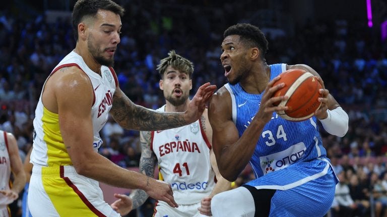 Greece's Giannis Antetokounmpo, right, drives the ball as Spain's Willy Hernangomez defends during the Eurobasket, European Basketball Championship Group C match between Spain and Greece at Spyros Kyprianou Arena, in Limassol, Cyprus, Thursday, Sept. 4, 2025. (AP Photo/Sakis Savvides)