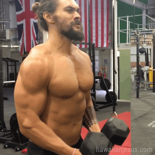 Jason Momoa doing some arm workout. Maybe a fly thingy? 