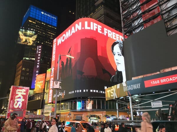 A billboard in New York’s Times Square featuring Ms. Amini’s likeness reads, “Woman. Life. Freedom.” A billboard in New York’s Times Square featuring Ms. Amini’s likeness reads, “Woman. Life. Freedom.”