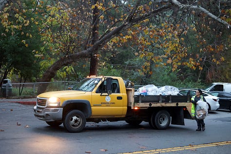 A person in a shared environment, photographed from a distance to preserve anonymity and atmosphere.