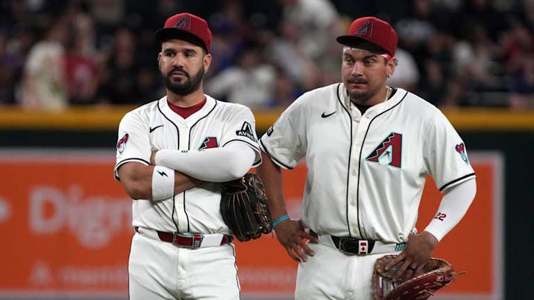 Jun 9, 2025; Phoenix, Arizona, USA; Arizona Diamondbacks third base Eugenio Suarez (28) and first base Josh Naylor (22) talk in the ninth inning against the Seattle Mariners at Chase Field. Mandatory Credit: Rick Scuteri-Imagn Images | Rick Scuteri-Imagn Images