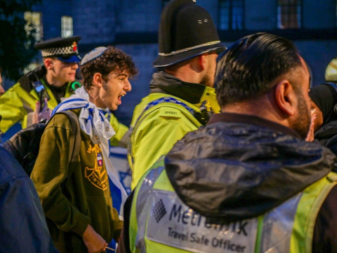 A group of men standing next to each other A group of men standing next to each other