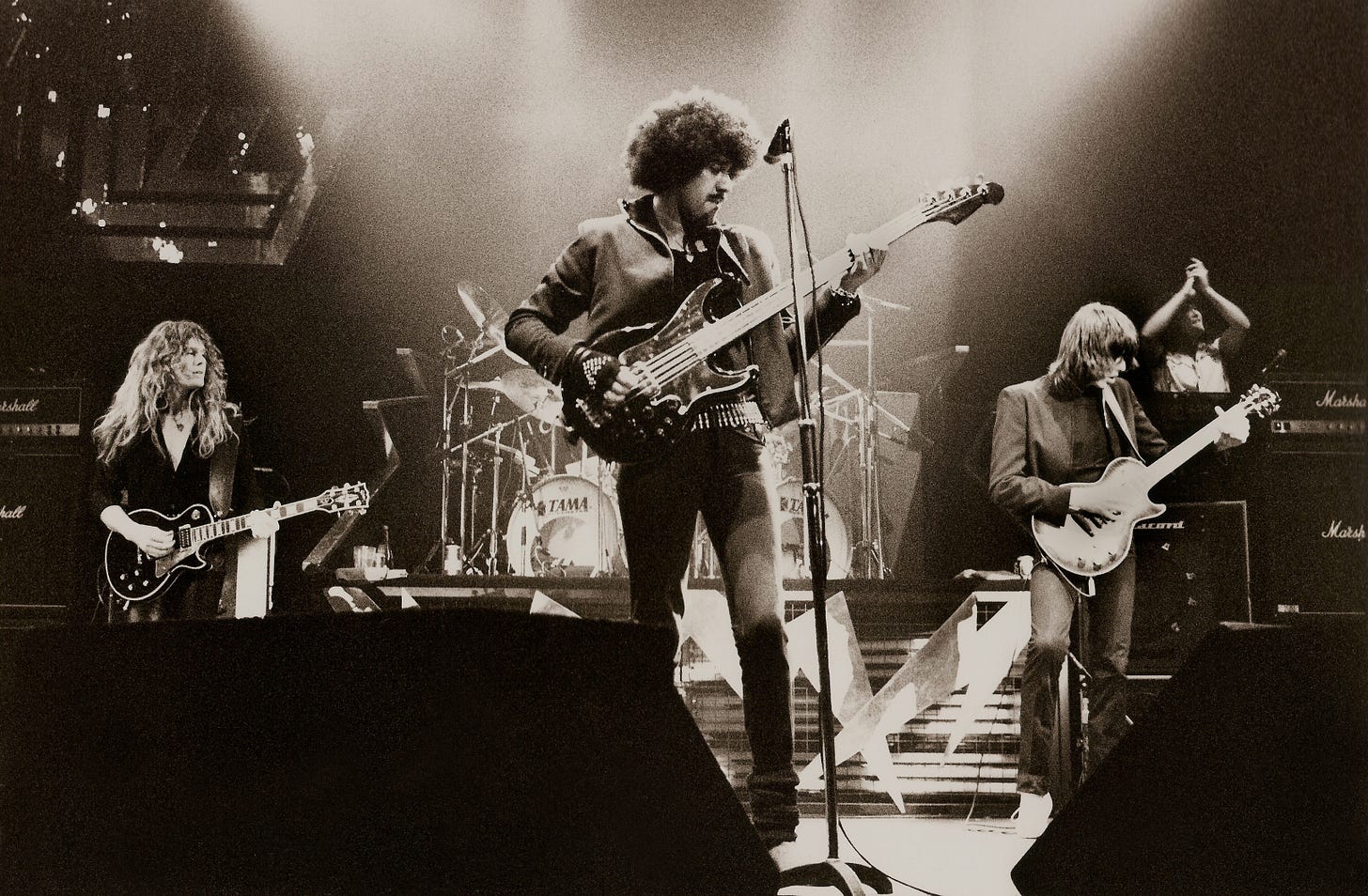 Thin Lizzy playing on stage.