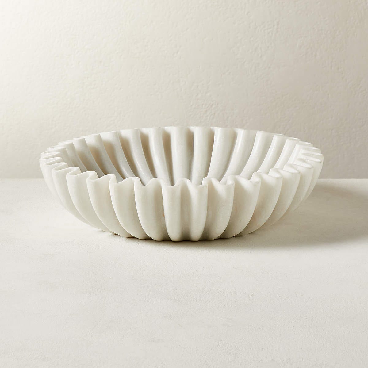 CB2's Reve Round Fluted White Marble Bowl