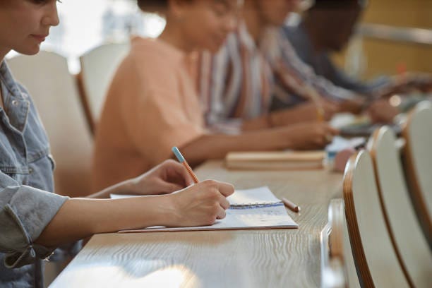 Schoolgirl making notes at lecture