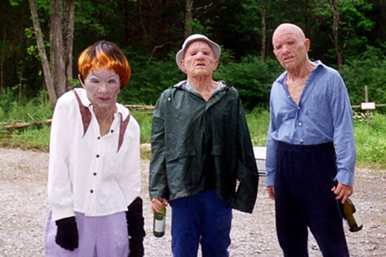 Three people made up to look like elderly perverts