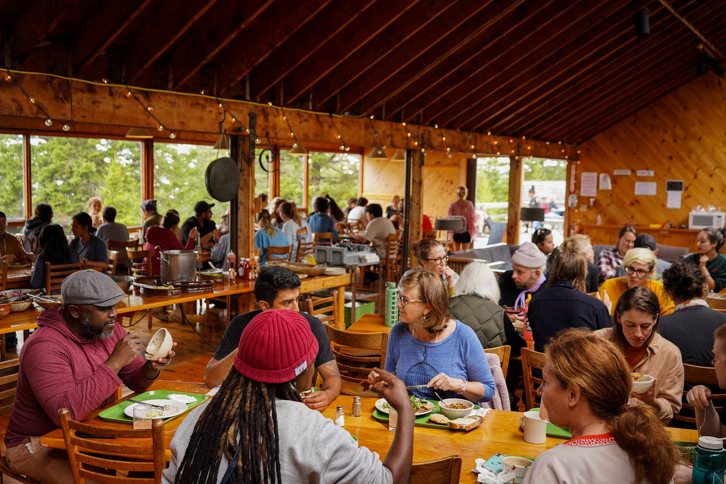 artisans gather in the community dining hall to enjoy a meal and good company