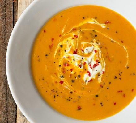 Butternut squash soup in bowl with chilli and crème fraîche