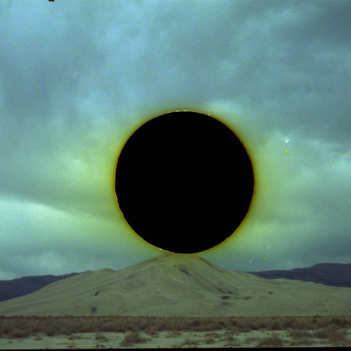 This may contain: a black hole in the sky with an airplane flying past it on a cloudy day