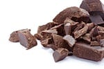 close up of chocolate pieces on white background close up of chocolate pieces on white background