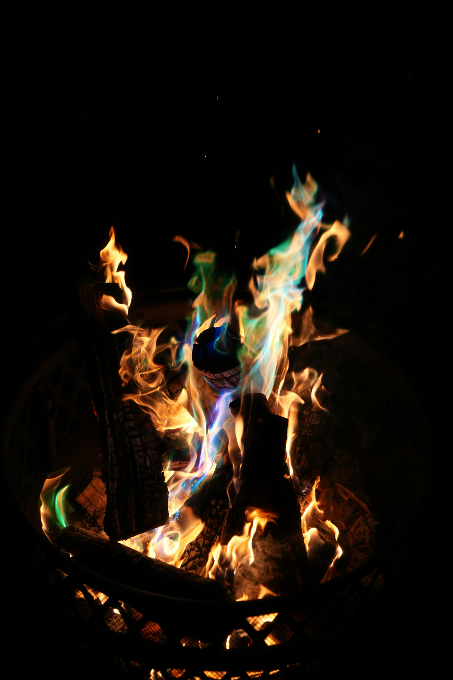 Portrait of colorful fire burning hot in a dark space Portrait of colorful fire burning hot in a dark space