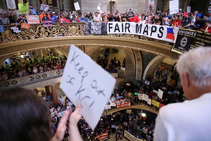 Protestors gather in the rotunda to protest a Republican-led redistricting plan at the Missouri State Capitol, in Jefferson City, Missouri, on Wednesday.