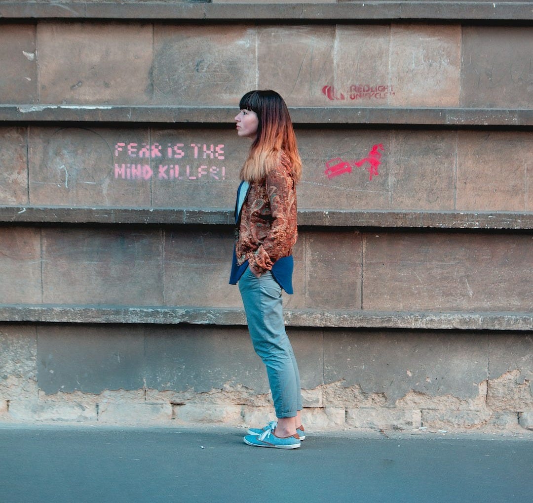 woman standing by wall