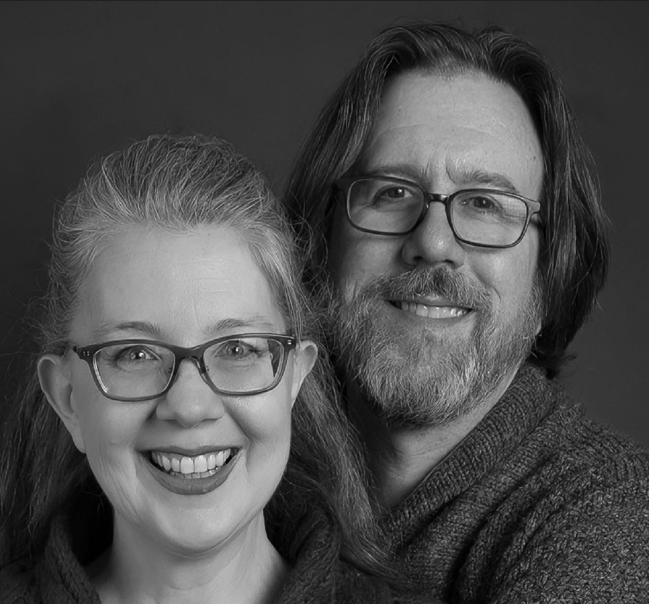 Black and white image of a woman's face and a man's face, both smiling, with both faces now in focus after software processing. Black and white image of a woman's face and a man's face, both smiling, with both faces now in focus after software processing.