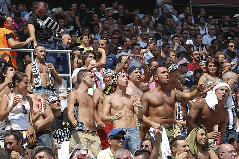 Juventus vs Parma, September 11, 2011: Arturo Vidal celebrates scoring on his debut, Juventus players embrace, fans erupt in celebration, Del Piero and teammates on the pitch, and Gianluigi Buffon giving a thumbs up during the opening match at Juventus Stadium.