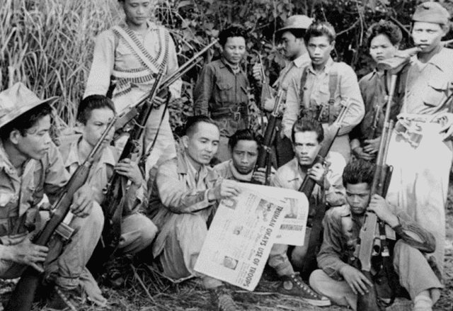 Few members of Hukbalahap, the Hukbong Bayan Laban sa Hapon, wearing their uniforms and some members are holding riffles. Few members of Hukbalahap, the Hukbong Bayan Laban sa Hapon, wearing their uniforms and some members are holding riffles.