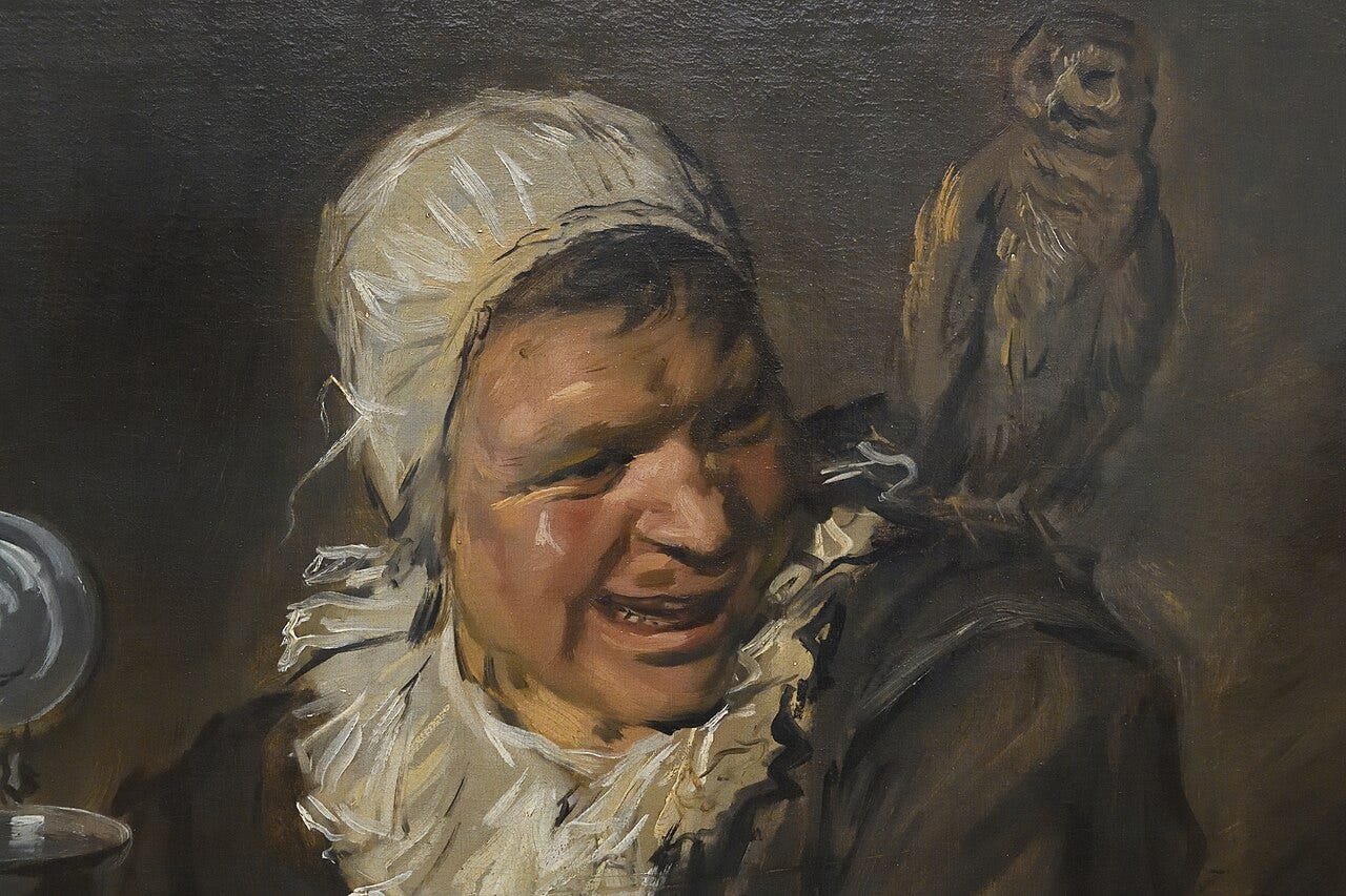 Woman laughing with owl