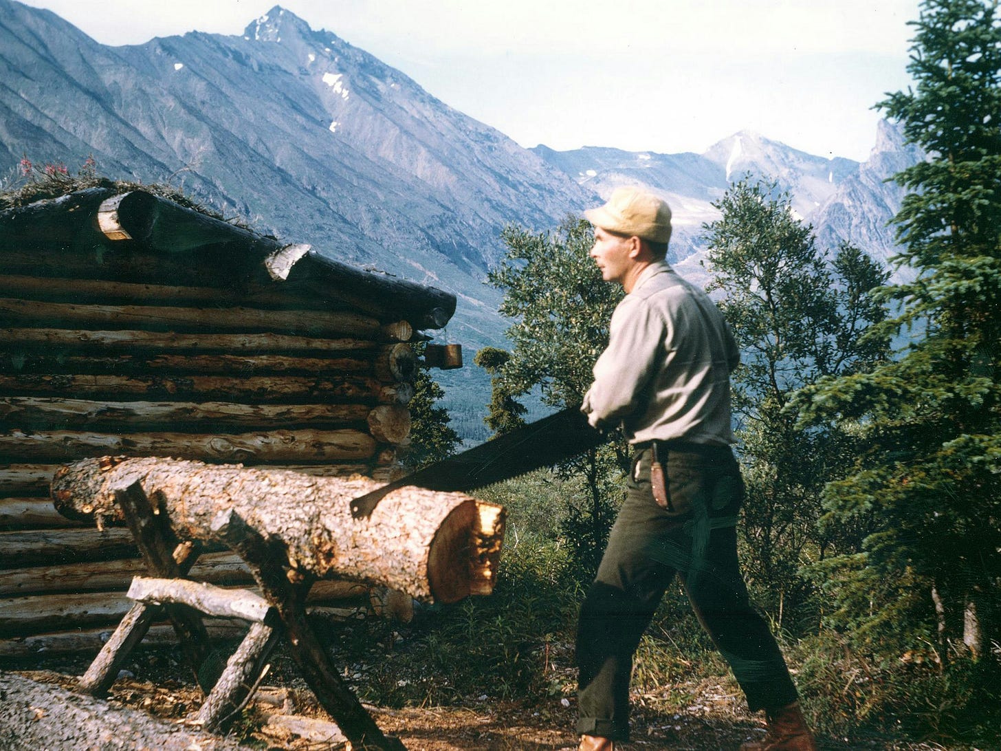 Dick Proenneke working on his cabin at Twin Lake in the wilderness of Alaska. Dick Proenneke working on his cabin at Twin Lake in the wilderness of Alaska.