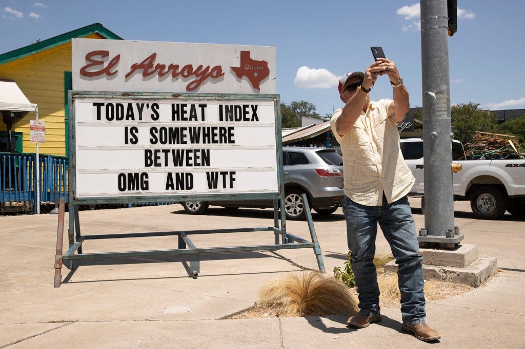 Mitchell Clearman takes a photo of a sign at El Arroyo restaurant in Austin, Texas, on a hot afternoon, Thursday, June 23, 2022. Mitchell Clearman takes a photo of a sign at El Arroyo restaurant in Austin, Texas, on a hot afternoon, Thursday, June 23, 2022.