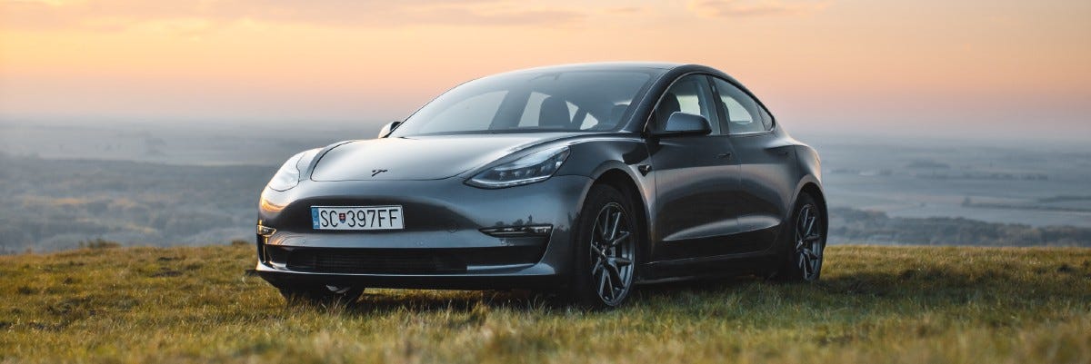 Tesla EV on a hillside Tesla EV on a hillside
