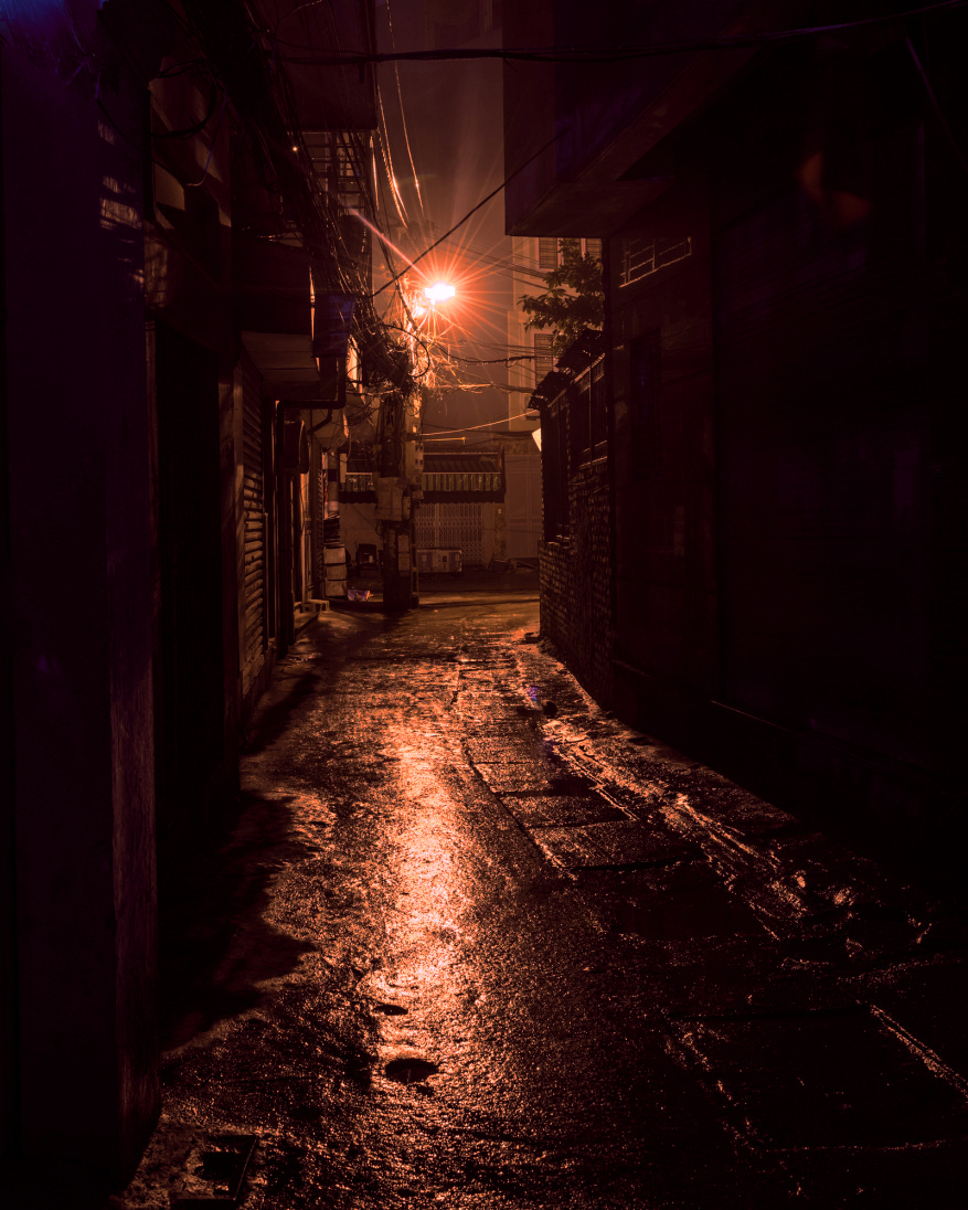 Narrow and scary deserted street at nightime
