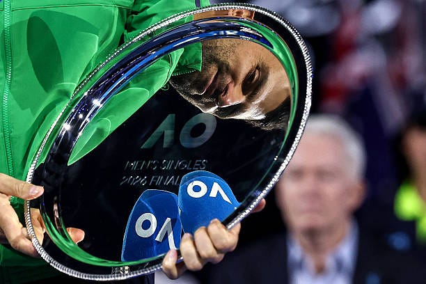 Serbia's Novak Djokovic looks at the runner-up shield following his defeat to Spain's Carlos Alcaraz in the men's singles final on Day 15 of the... Serbia's Novak Djokovic looks at the runner-up shield following his defeat to Spain's Carlos Alcaraz in the men's singles final on Day 15 of the...